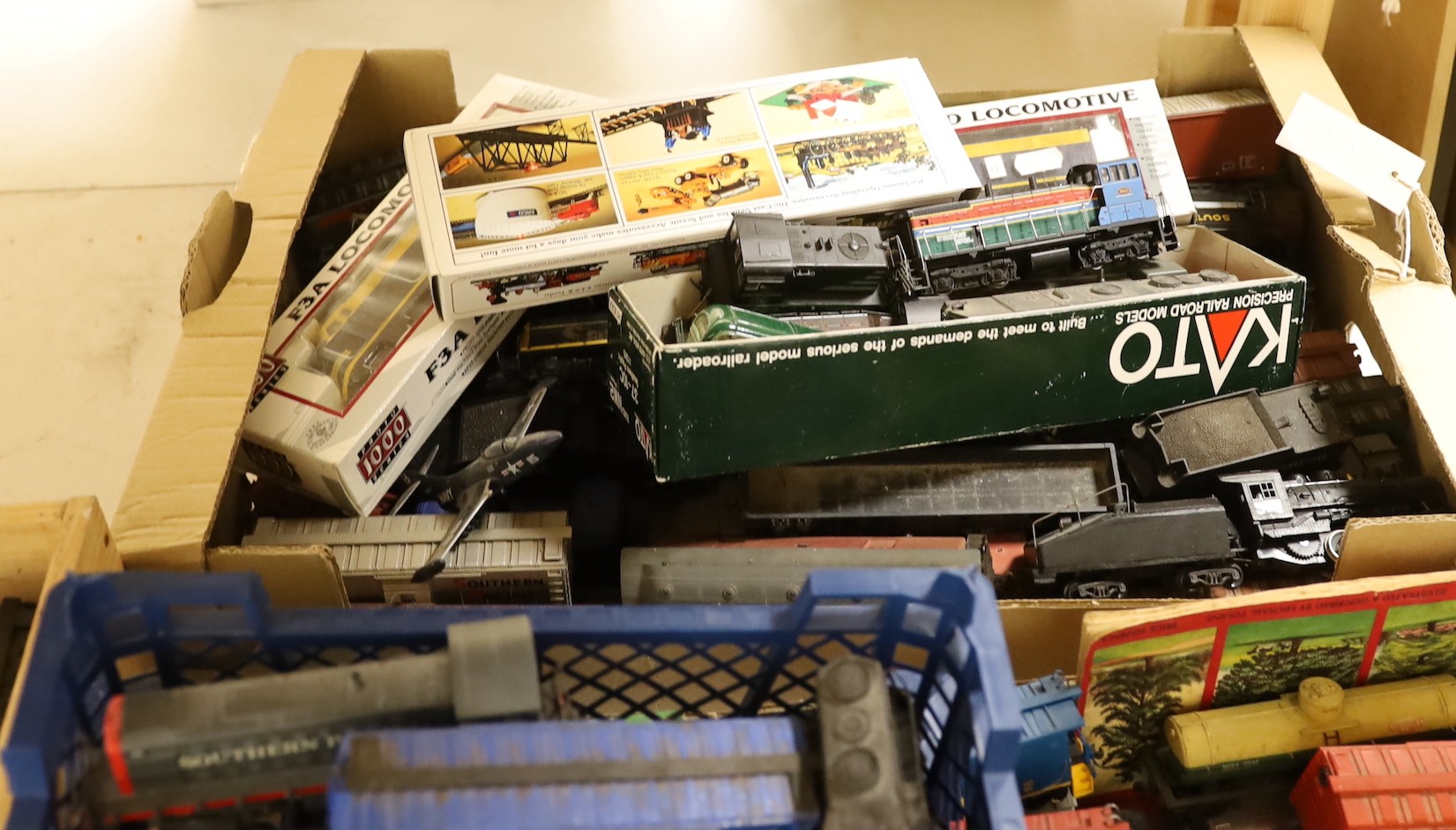 A large collection of 00 gauge toy locomotives and rolling stock